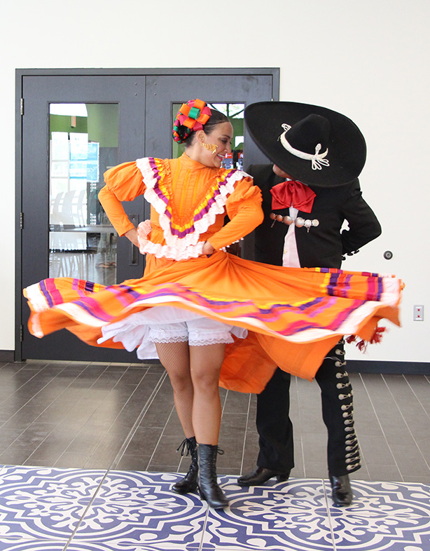 Marlene Pita and Rodrigo Gonzalez of the Guadalupe Dance Company perform a folklorico dance native to the Mexican state of Jalisco Sep. 15 in the cafeteria as part of the university’s Hispanic History Month celebrations. The influence of the state’s numerous ranches is represented by Gonzalez’s charro suit and Pita’s dress design. Photo by Emily Rodriguez