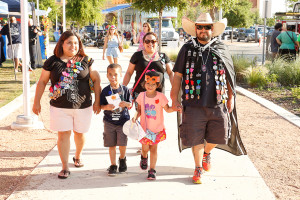The Gomez family heads home after a long day at Festival of Cascarones. Photo by Joe Turner