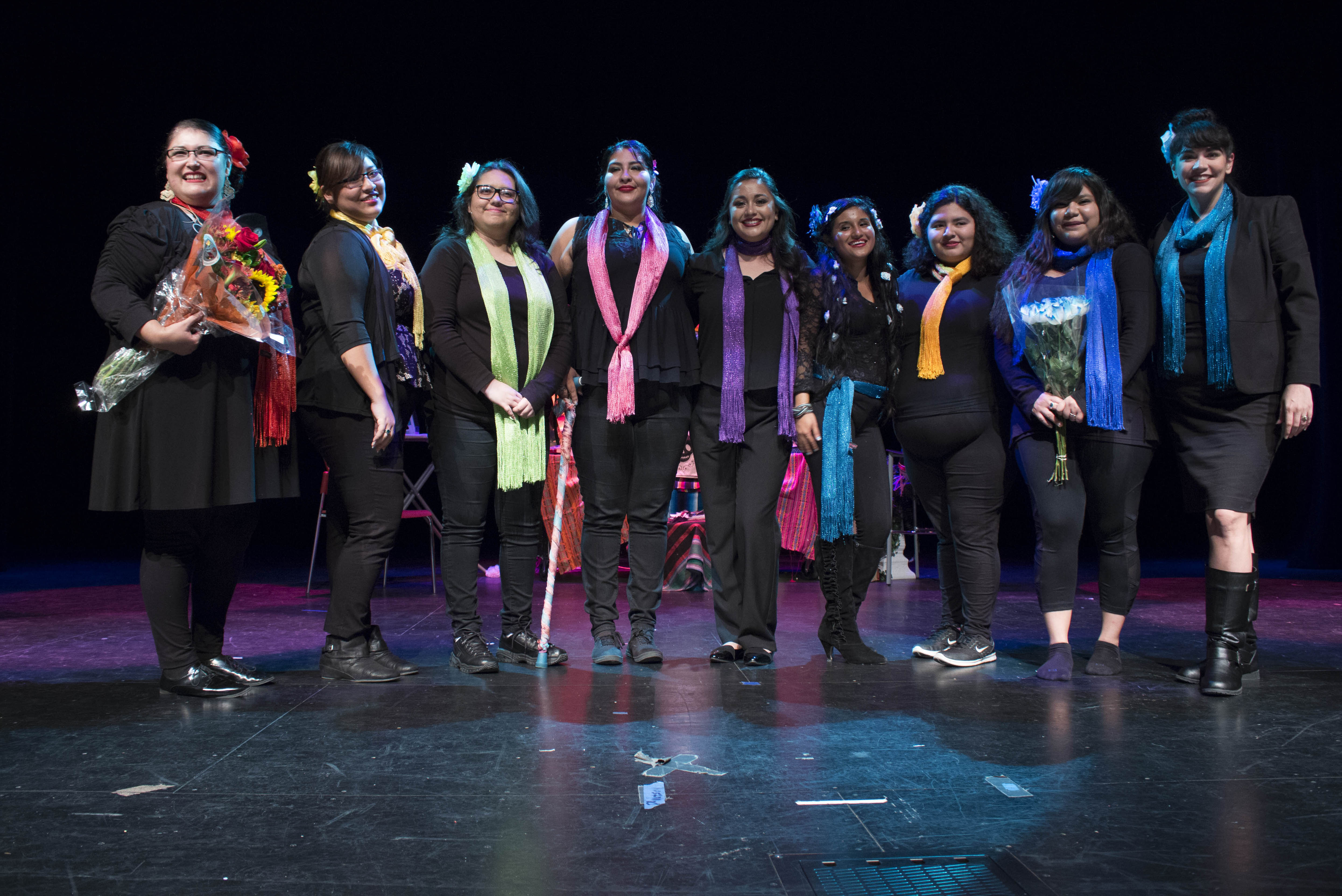 From Left to Right, Monica Cortez, Marissa Luna, Ruth Mini, Sulema Hernadez, Celilia McCardle, Kathryn Pearl, Martha Reyna, Kayla Garcia, and Professor Adrianna Michelle Santos, Ph.D standing together at the end of the preformance. Photo by Josiah Cuellar 