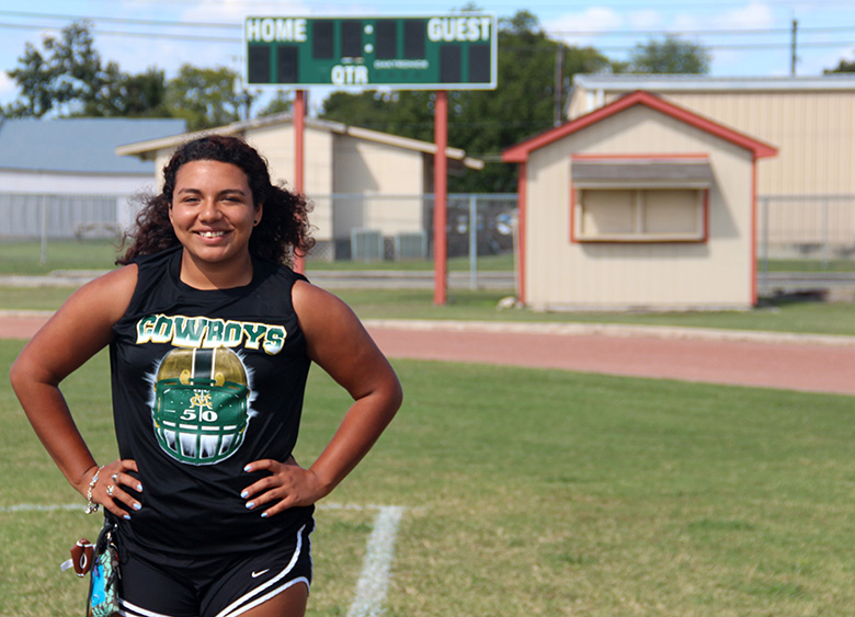 Trinity Chavez, senior at McCollum High School, poses on her home field where she has played numerous football games in the past fours years. Photo by Emily Twyford