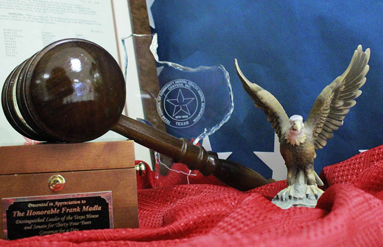 Trophies and mementos inside a cabinet at Frank Madla Elementary, to honor the Late Senator, Frank Madla and his triumphs in education.